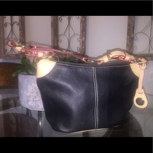 Dooney and Burke Black purse with Tan strap.